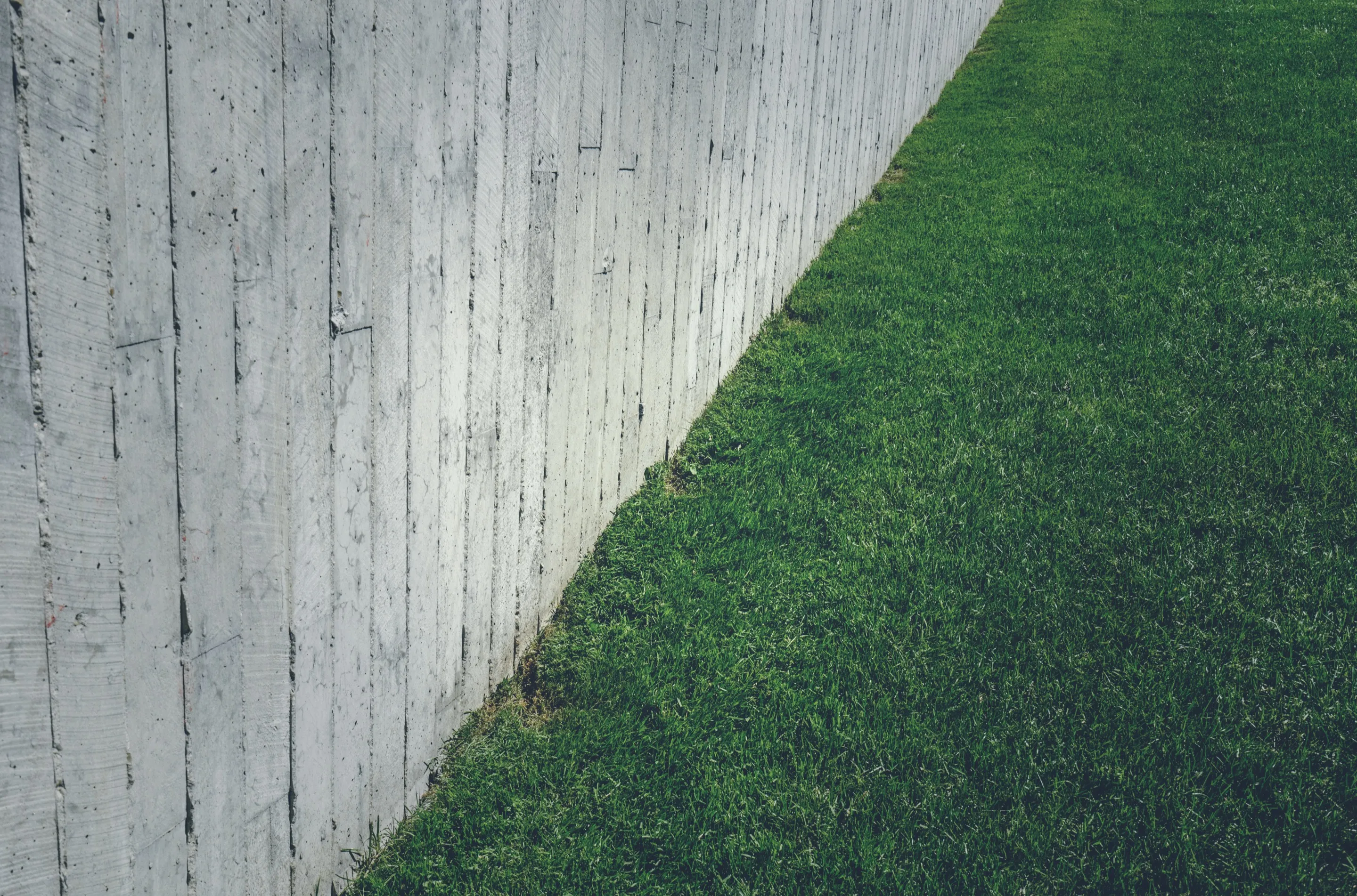 Grass lawn with concrete wall